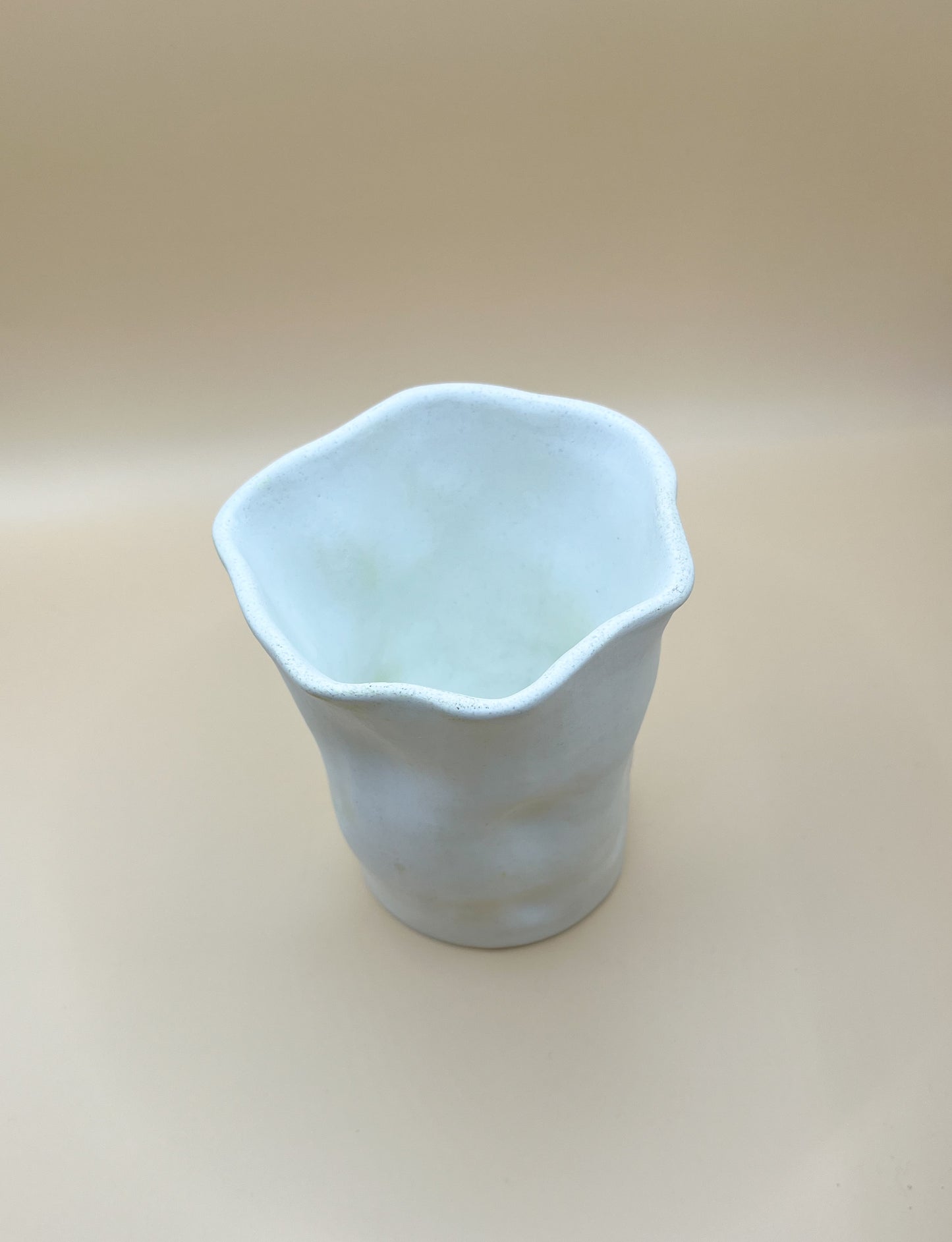 Crumpled glass ceramic looking vase